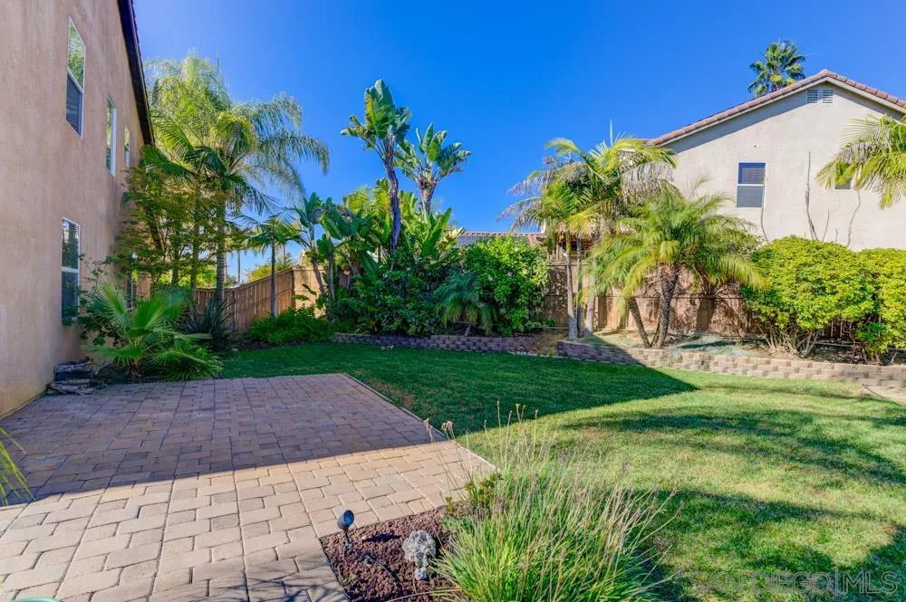 344 Natalie Way Fallbrook, CA 92028 - Photo 22 of 37 a view of a back yard with flower plants