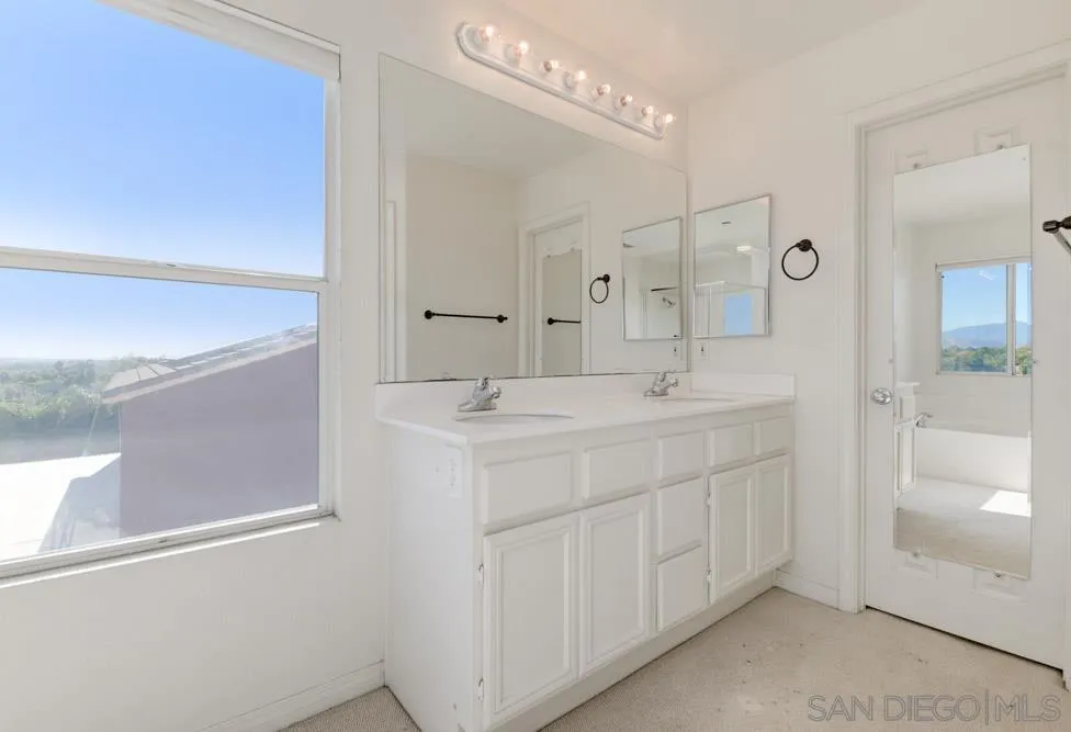 344 Natalie Way Fallbrook, CA 92028 - Photo 29 of 37 a bathroom with a double vanity sink mirror and shower