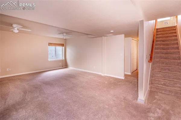 a bedroom with a large bed and a flat screen tv