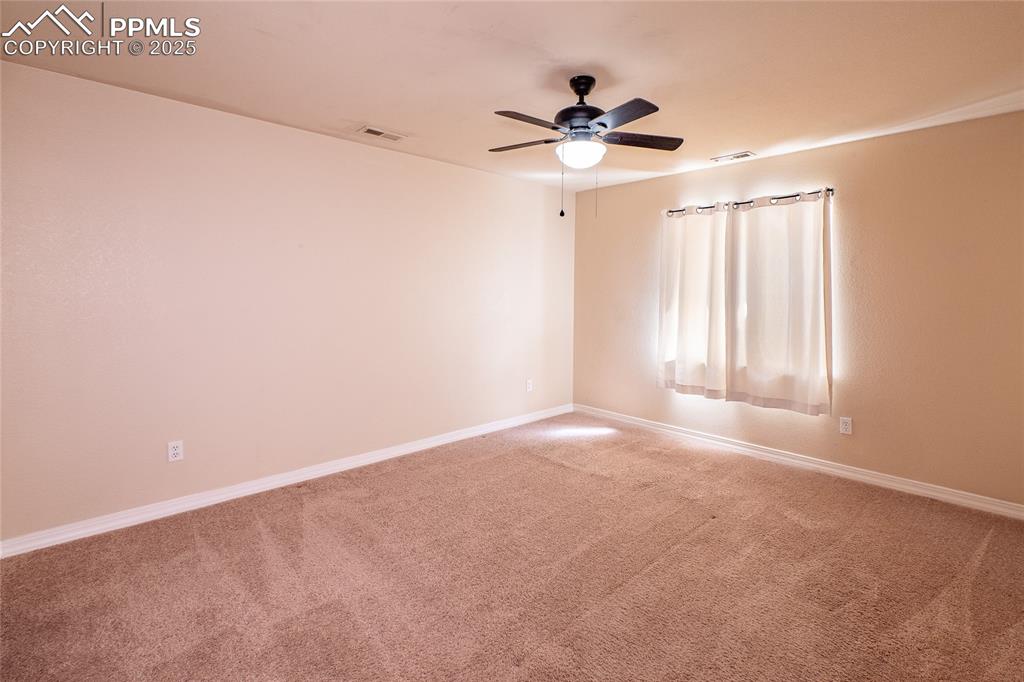 7313 Owings Point Peyton, CO 80831 - Photo 25 of 47 Spare room featuring carpet floors and a ceiling fan