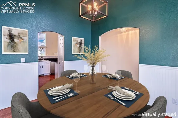 a kitchen with granite countertop a stove and a microwave