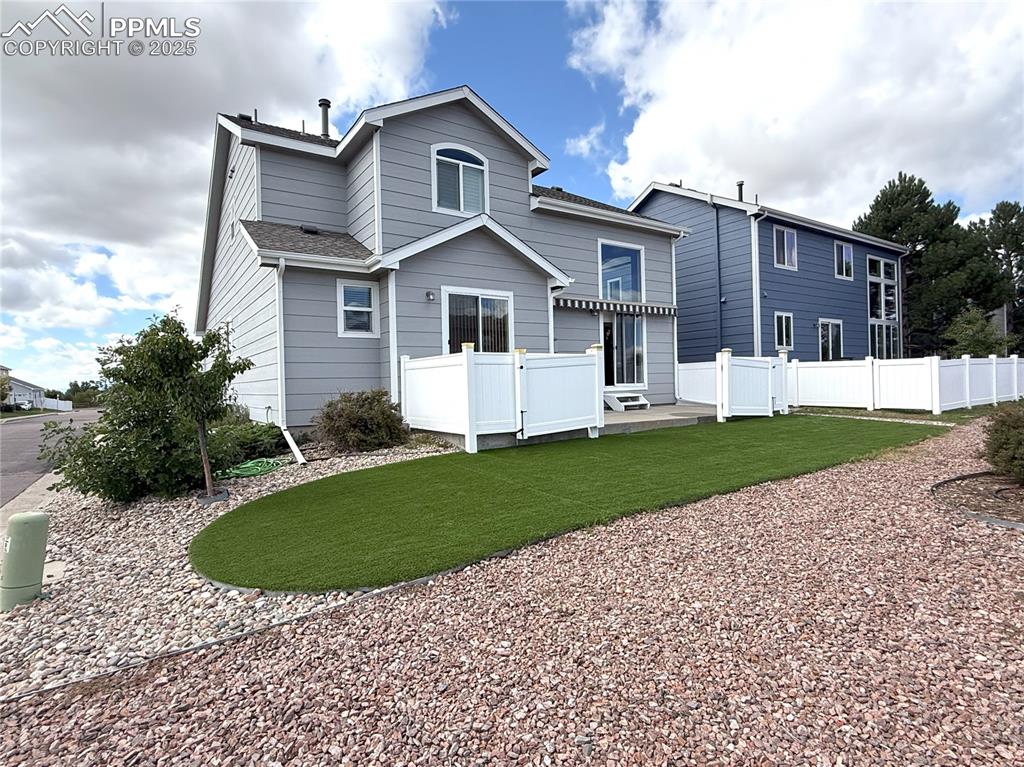 7313 Owings Point Peyton, CO 80831 - Photo 40 of 47 Rear view of house featuring a wooden deck