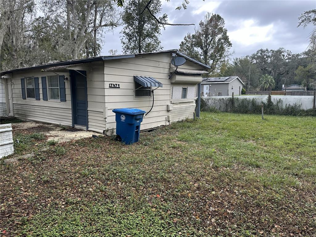 17479 Tavern Road Brooksville, FL 34604 - Photo 4 of 10 a front view of a house with garden