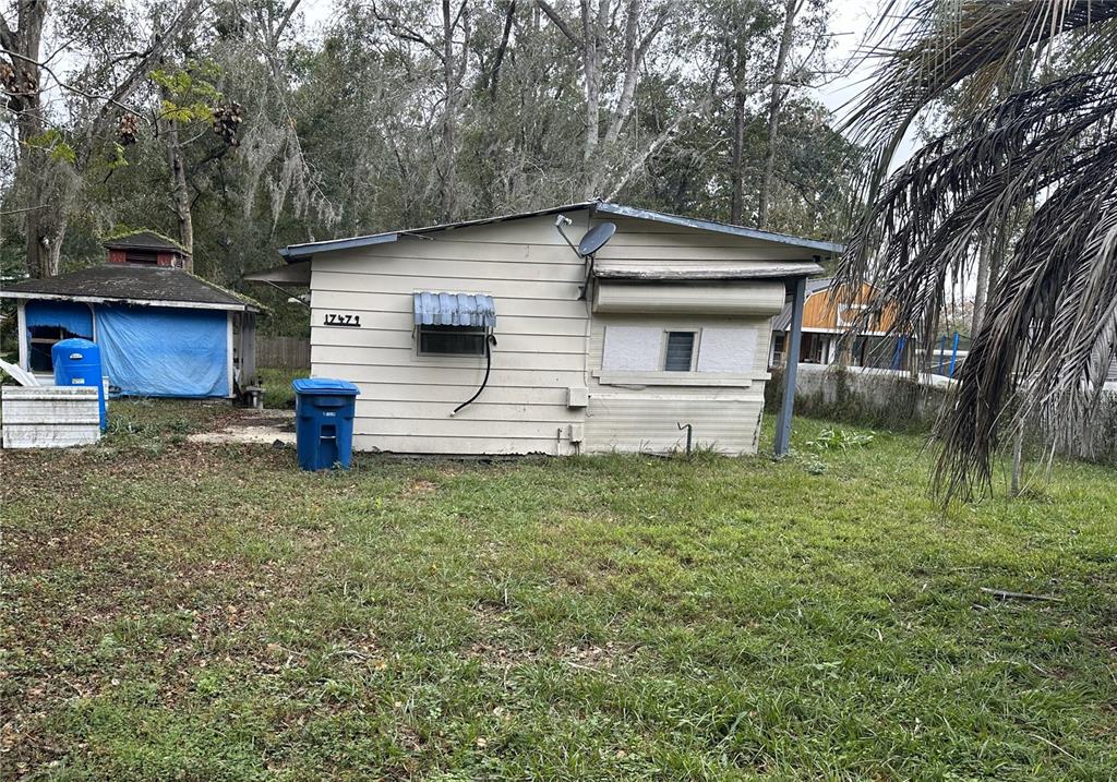 17479 Tavern Road Brooksville, FL 34604 - Photo 6 of 10 a front view of a house with a yard