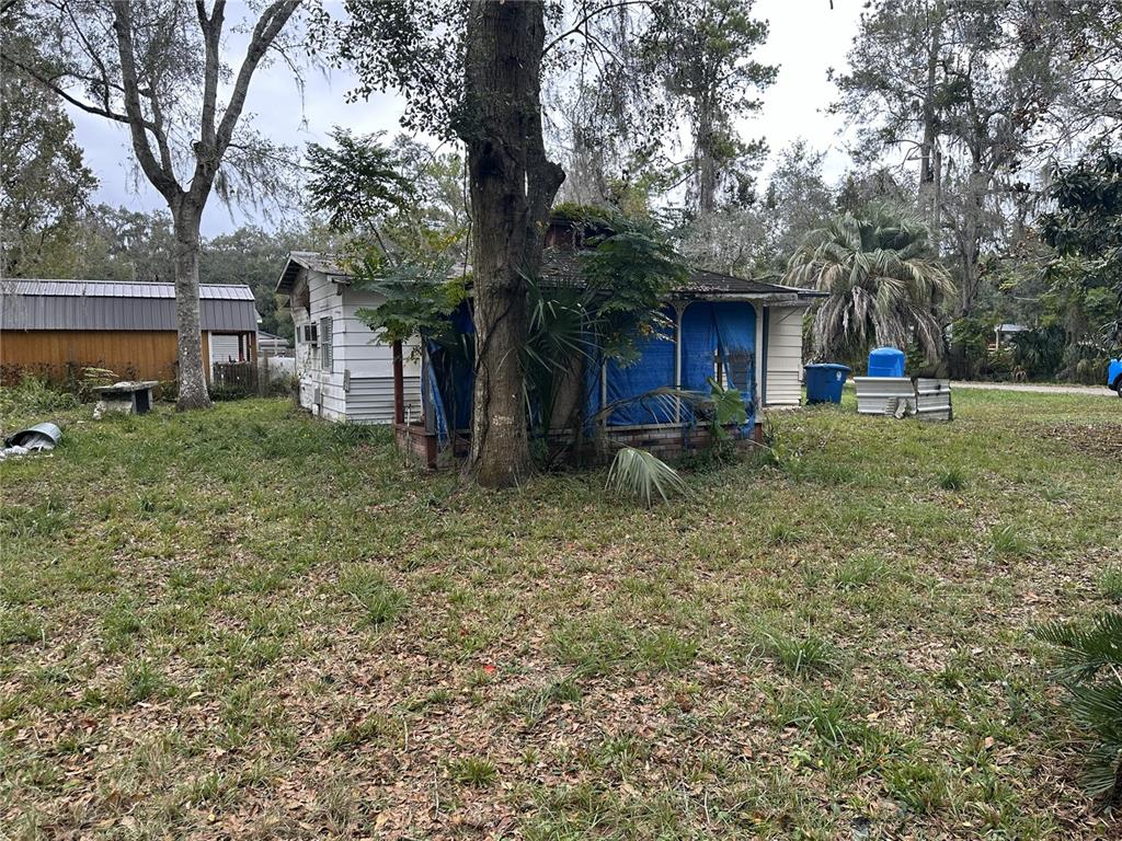 17479 Tavern Road Brooksville, FL 34604 - Photo 9 of 10 a house view with a backyard space