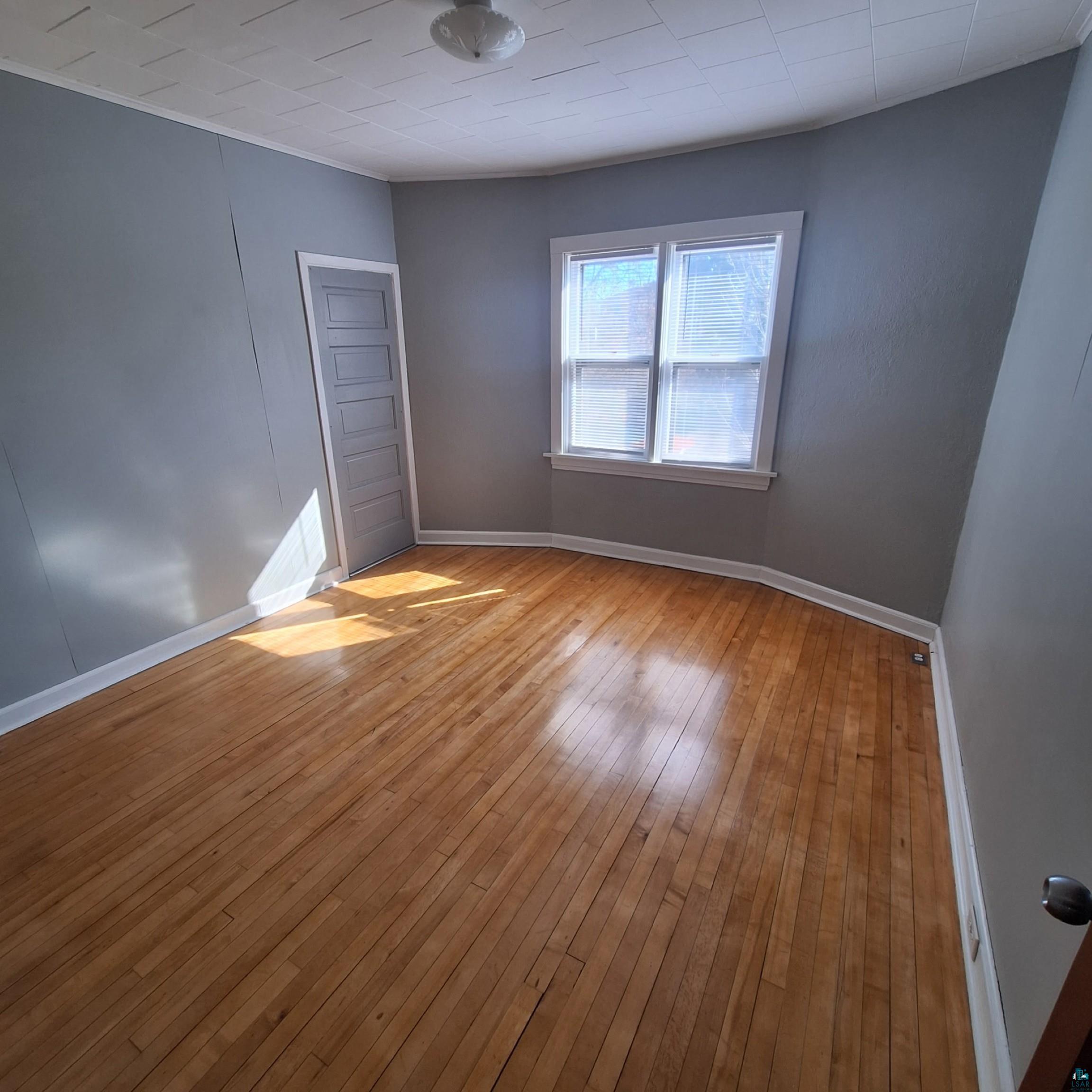 3141 Restormel Street Duluth, MN 55806 - Photo 13 of 13 Empty room featuring baseboards and light wood-style flooring