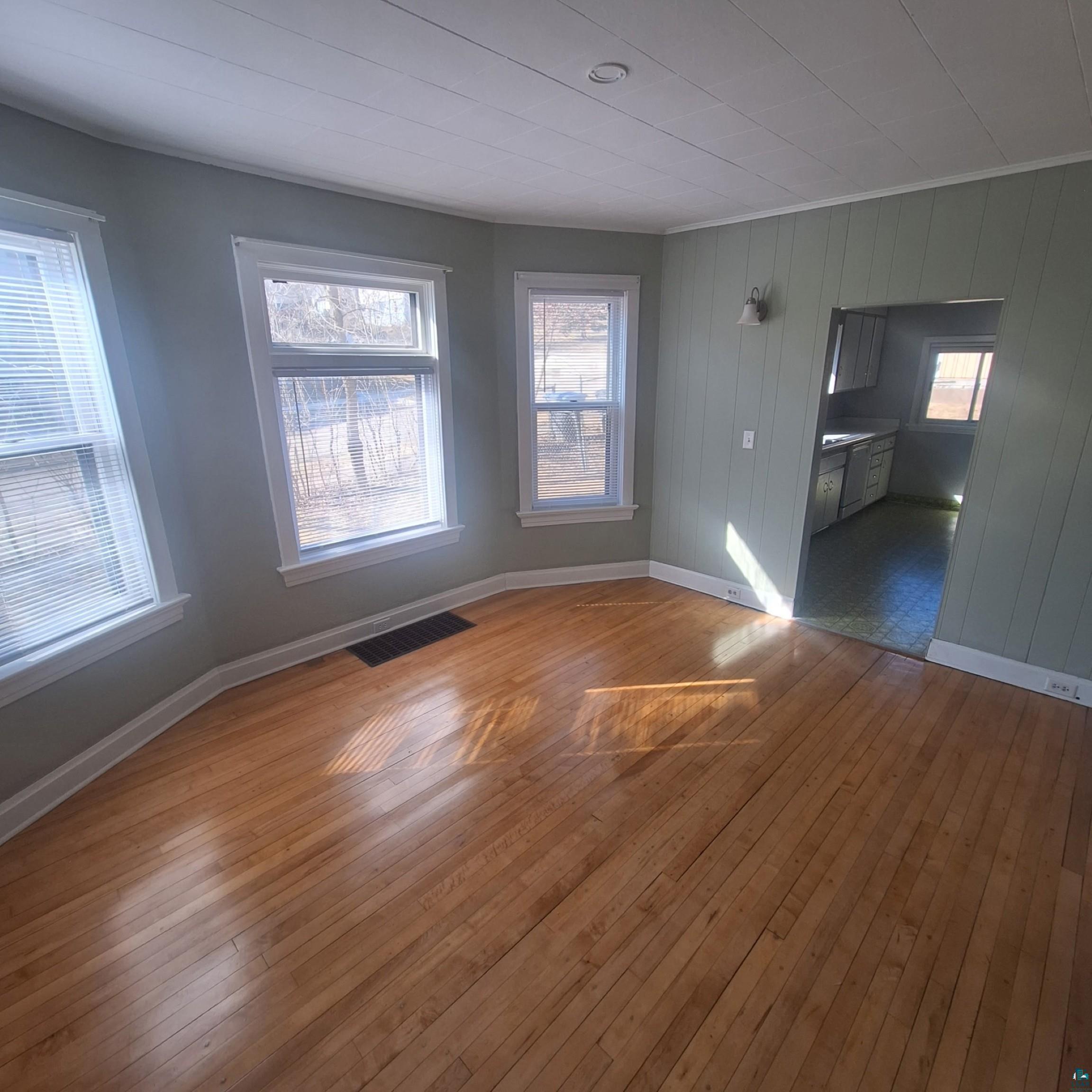 3141 Restormel Street Duluth, MN 55806 - Photo 3 of 13 Interior space featuring hardwood / wood-style floors, crown molding, baseboards, and visible vents