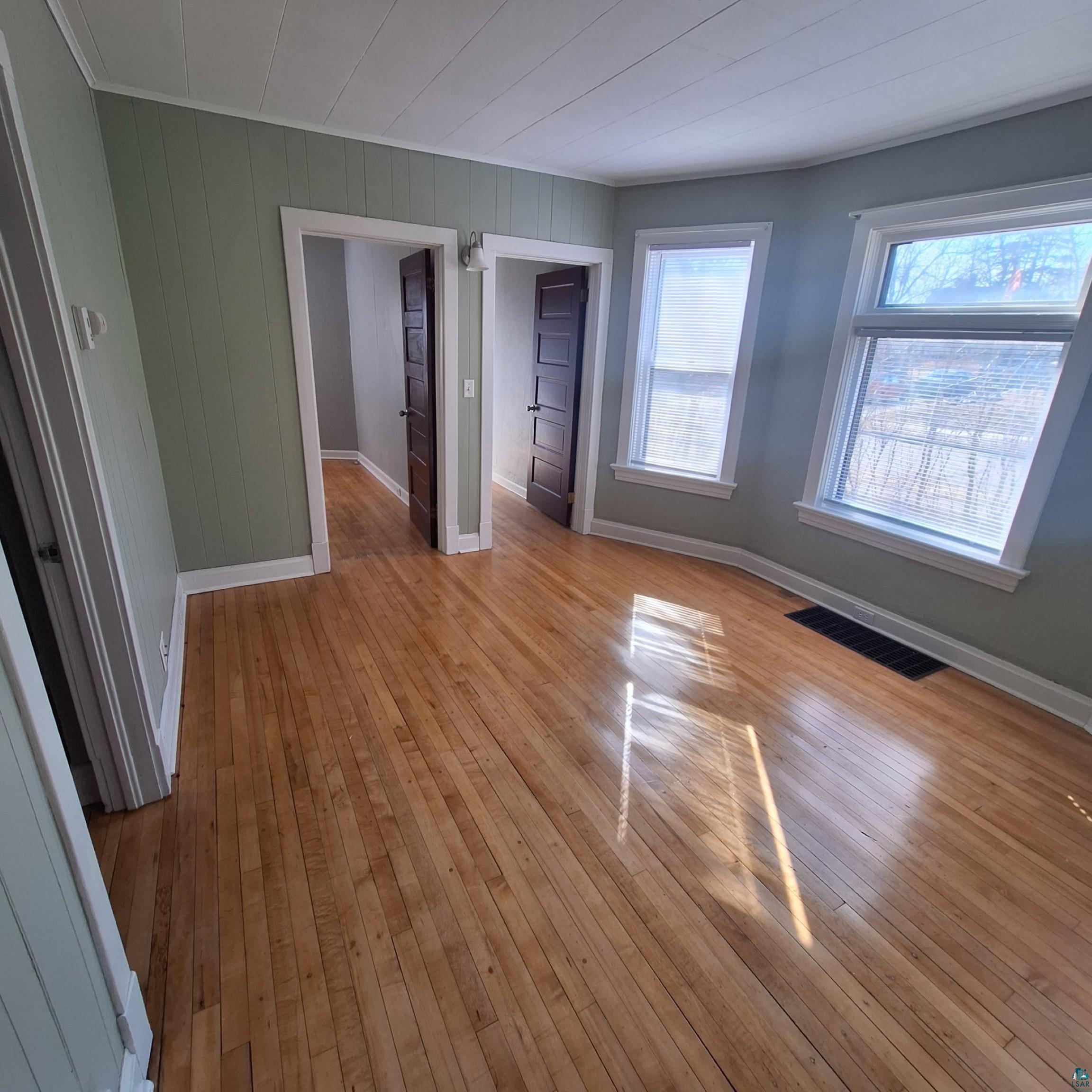 3141 Restormel Street Duluth, MN 55806 - Photo 4 of 13 Unfurnished bedroom with a closet, visible vents, light wood-type flooring, and baseboards