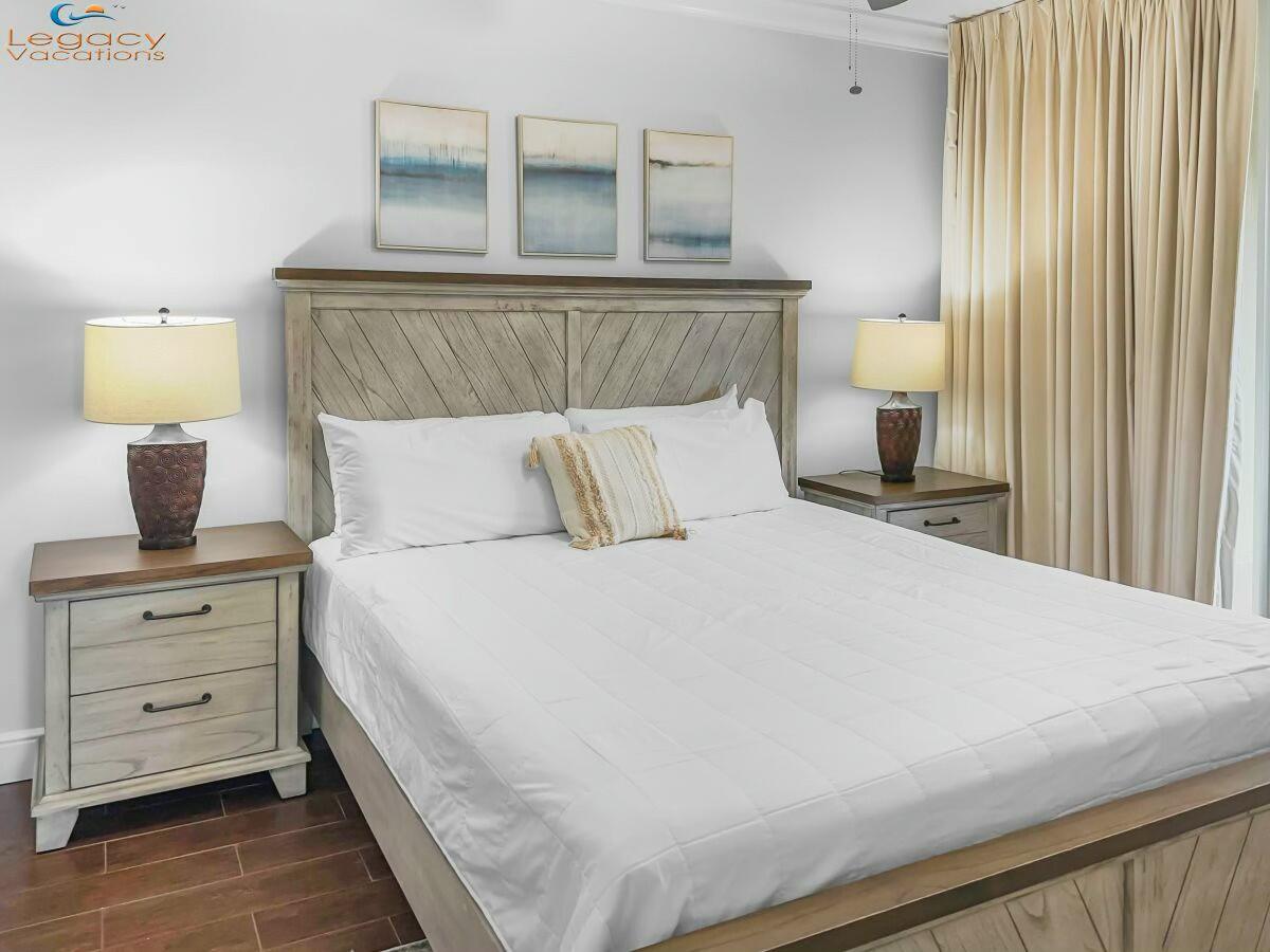 1150 Santa Rosa Boulevard, Unit 223 Fort Walton Beach, FL 32548 - Photo 15 of 53 a bedroom with a bed and lamp