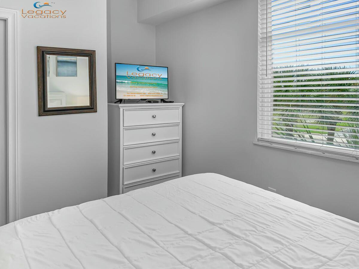 1150 Santa Rosa Boulevard, Unit 223 Fort Walton Beach, FL 32548 - Photo 23 of 53 a bedroom with a bed and a window