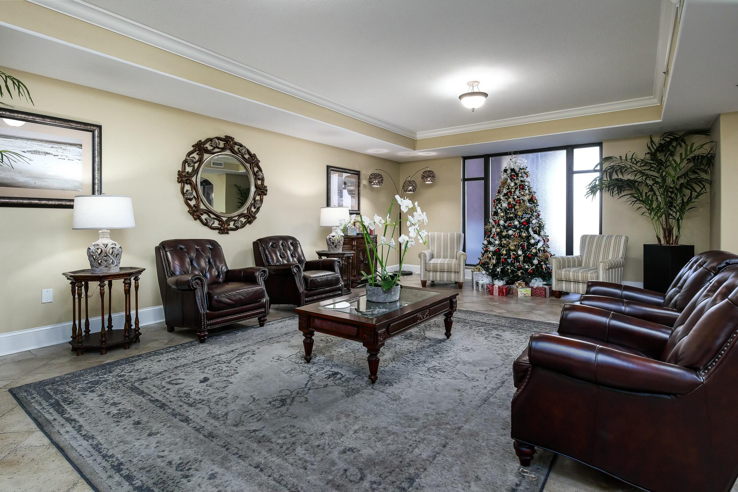 1150 Santa Rosa Boulevard, Unit 223 Fort Walton Beach, FL 32548 - Photo 34 of 53 a living room with furniture a table and a large window