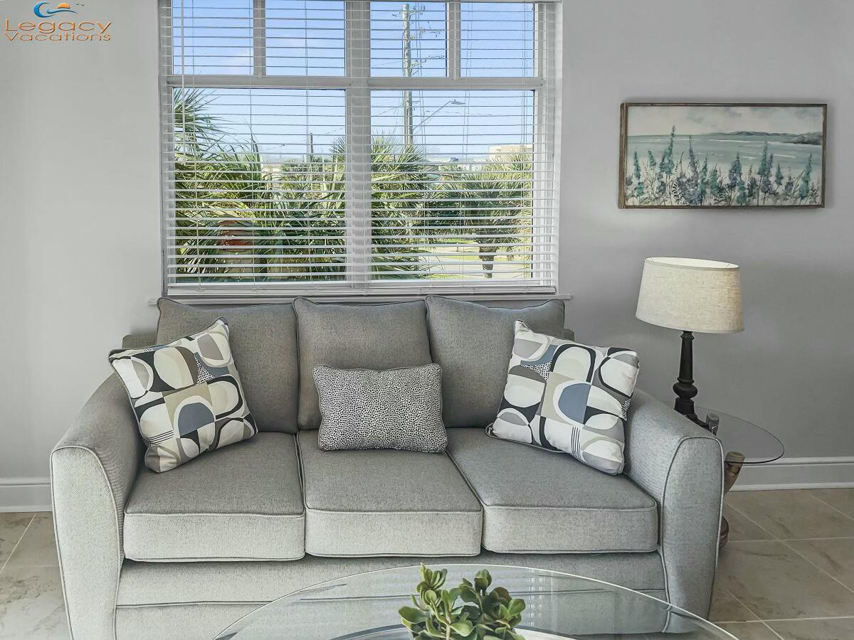 1150 Santa Rosa Boulevard, Unit 223 Fort Walton Beach, FL 32548 - Photo 8 of 53 a living room with furniture and a large window