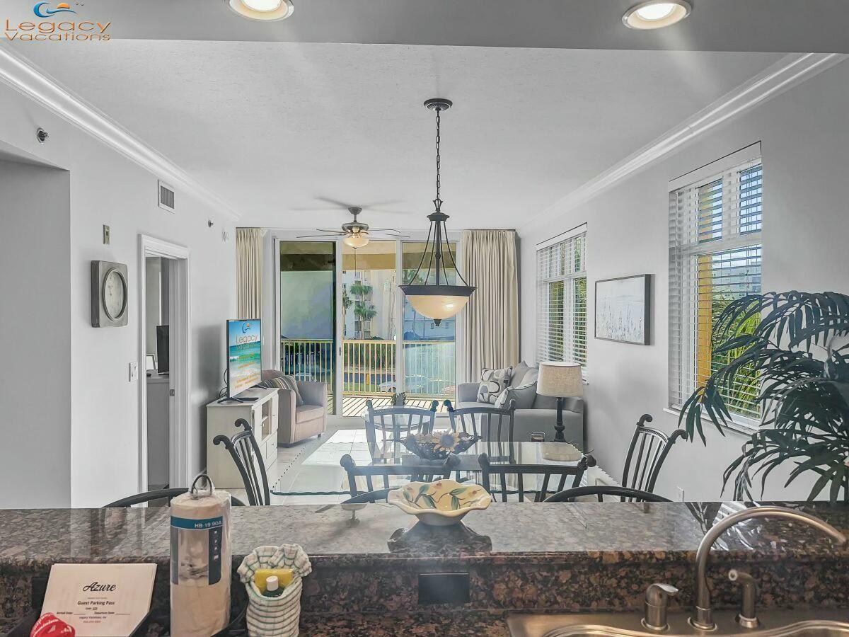 1150 Santa Rosa Boulevard, Unit 223 Fort Walton Beach, FL 32548 - Photo 10 of 53 a view of a livingroom with furniture and floor to ceiling window