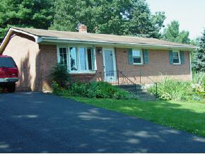 2516 Shutterlee Mill Road Staunton, VA 24401 - Photo 1 of 8 a view of a house with a yard