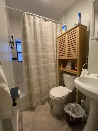 a bathroom with a toilet and a sink
