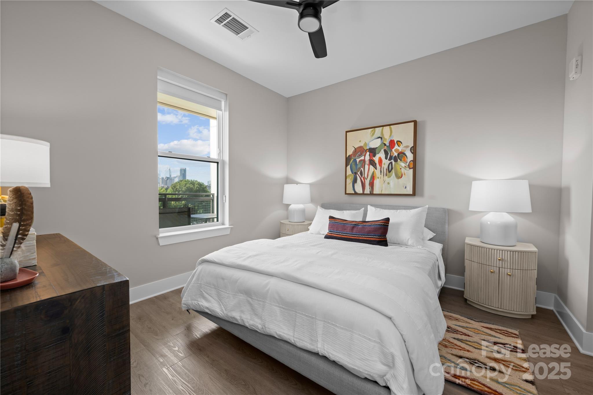 110 Razades Way, Unit B1 Charlotte, NC 28206 - Photo 12 of 29 a bedroom with a bed a dresser and next to a window