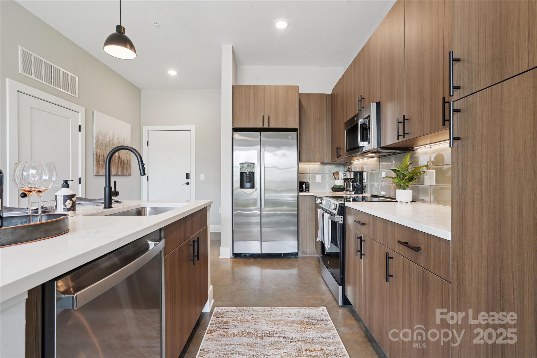 110 Razades Way, Unit B1 Charlotte, NC 28206 - Photo 15 of 29 a kitchen with stainless steel appliances granite countertop a sink refrigerator and cabinets
