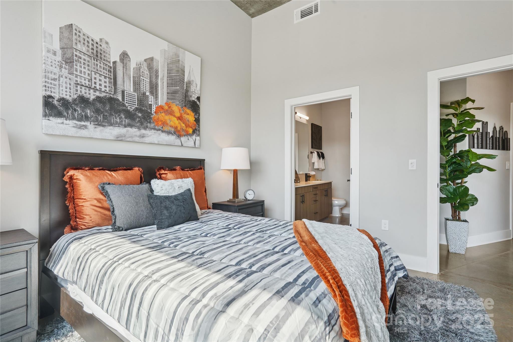 110 Razades Way, Unit B1 Charlotte, NC 28206 - Photo 17 of 29 a bedroom with bed and wooden floor