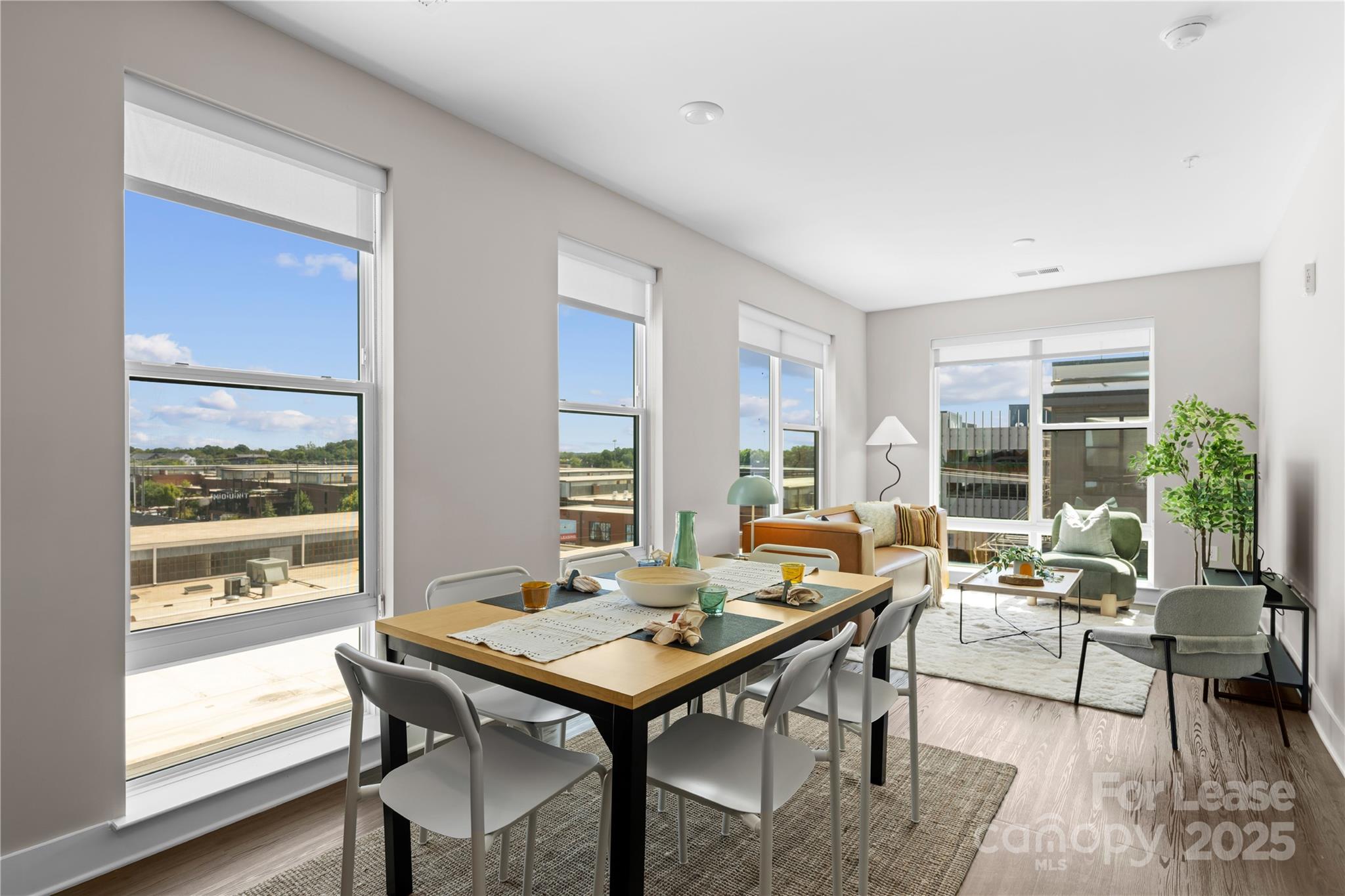 110 Razades Way, Unit B1 Charlotte, NC 28206 - Photo 25 of 29 a living room with furniture wooden floor and a window
