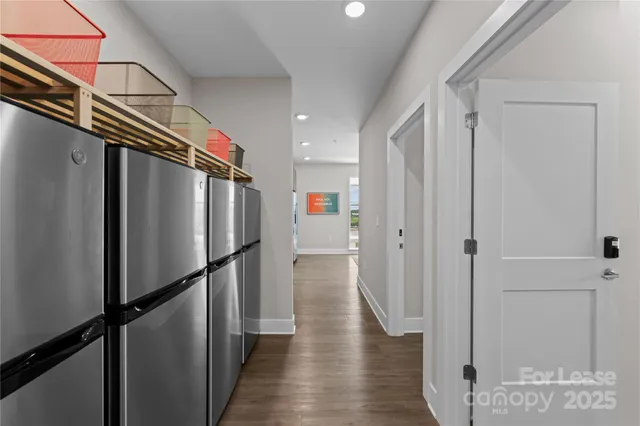 a view of a refrigerator and wooden floor