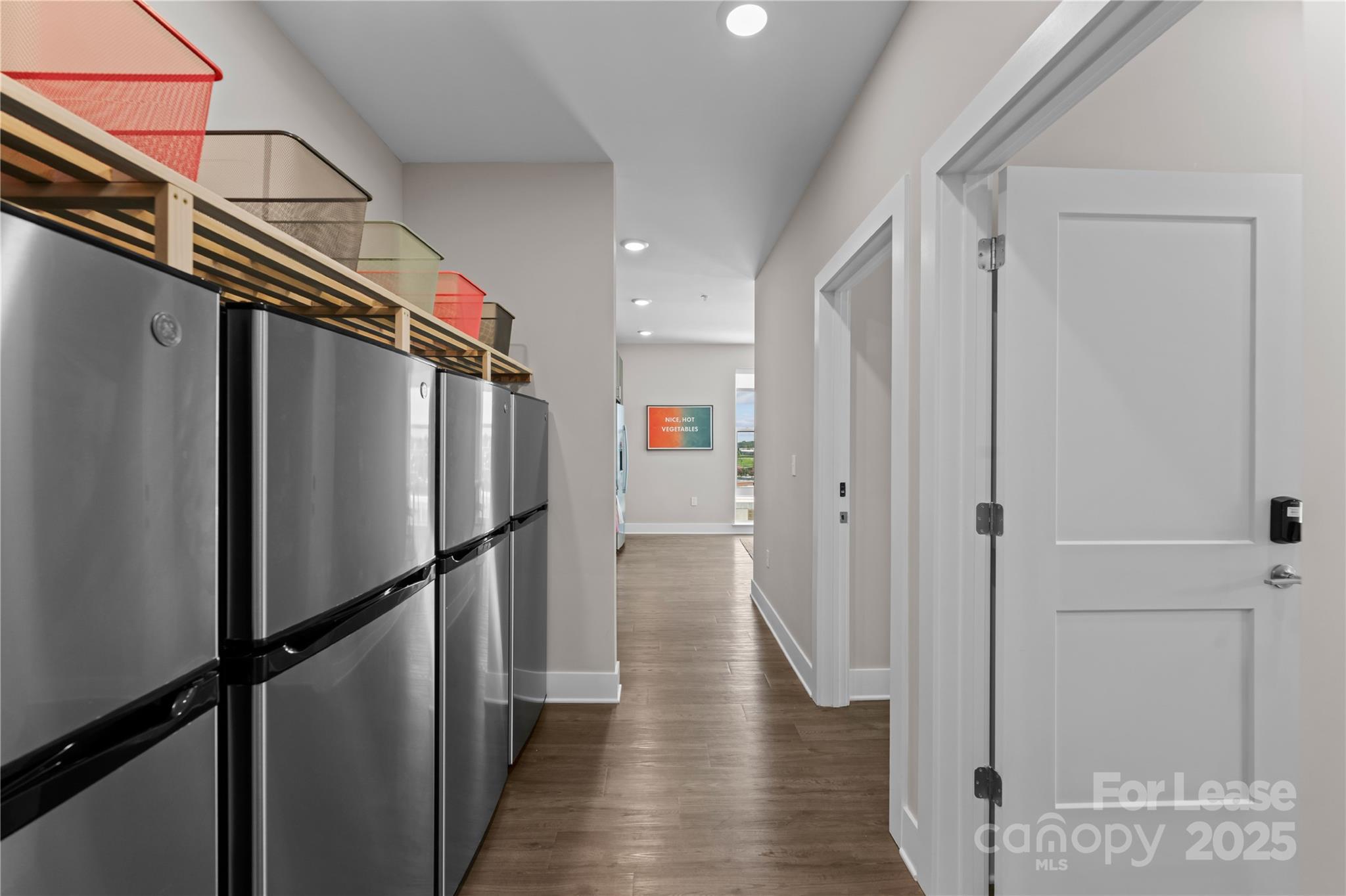 110 Razades Way, Unit B1 Charlotte, NC 28206 - Photo 27 of 29 a view of a refrigerator and wooden floor