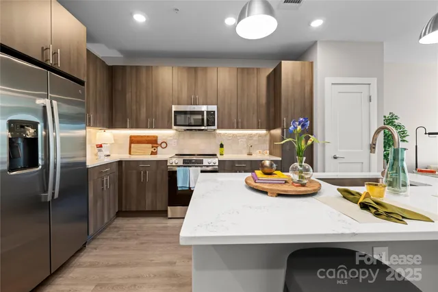 a kitchen with a refrigerator and a sink