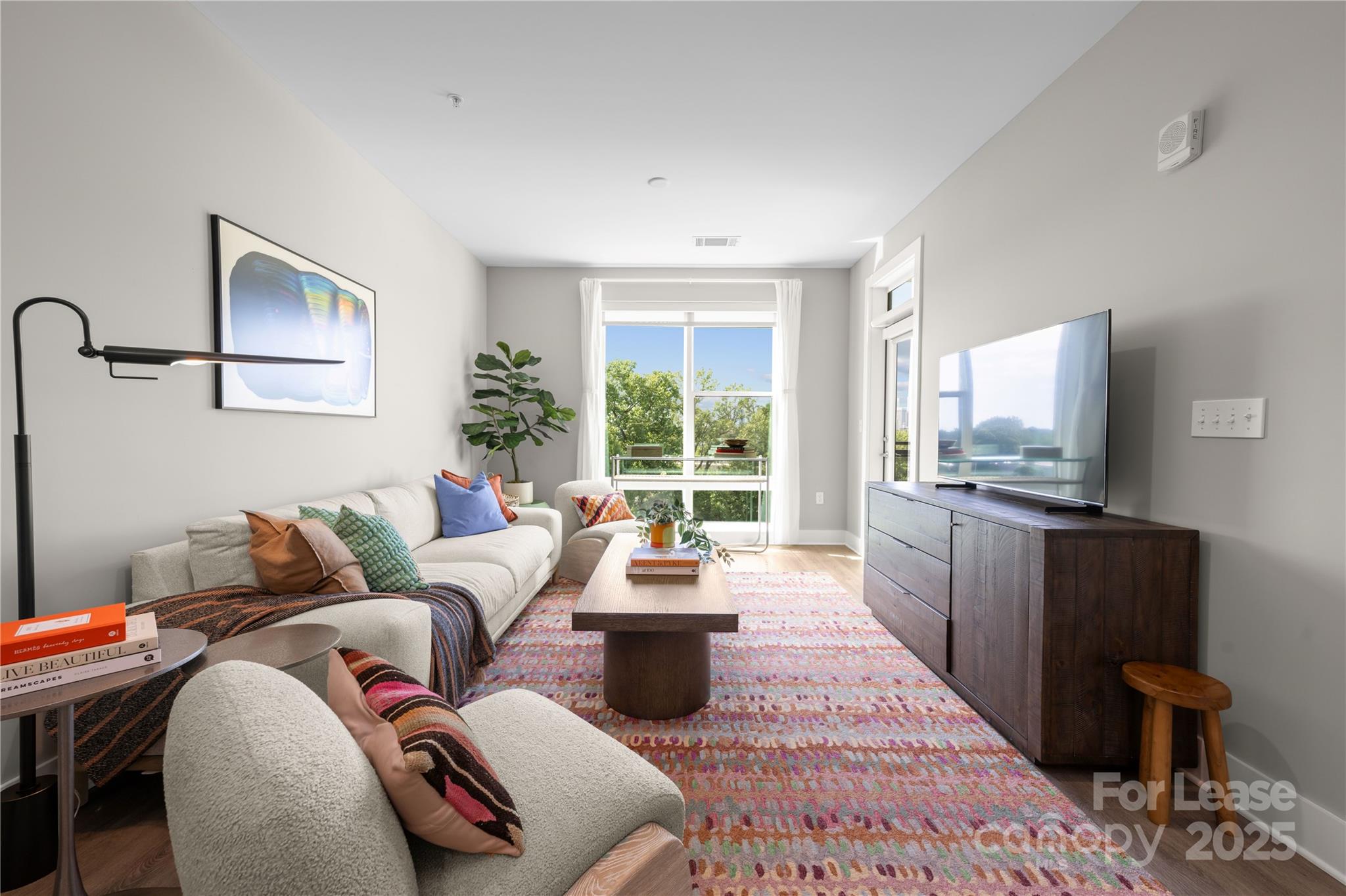 110 Razades Way, Unit B1 Charlotte, NC 28206 - Photo 10 of 29 a living room with furniture large window and flat screen tv