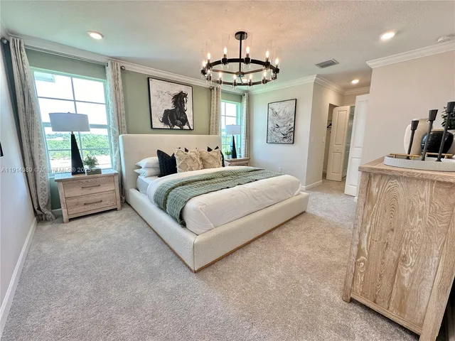 a bathroom with a double vanity sink mirror and shower