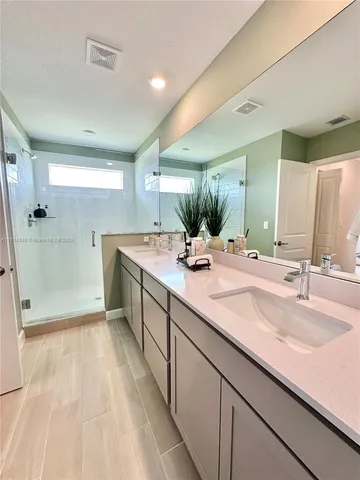 a bedroom with a bed and dresser