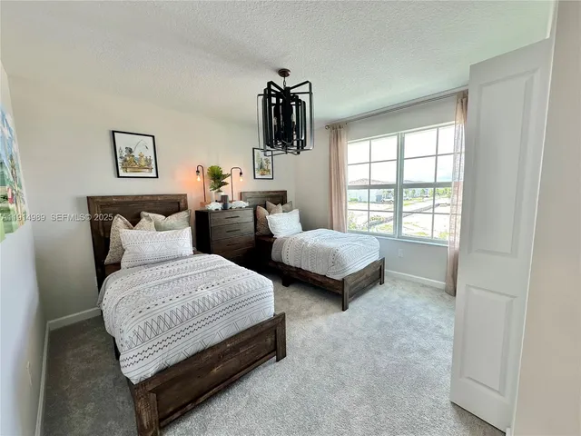a bedroom with furniture and a window