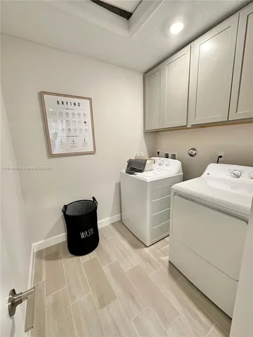 a bathroom with a double vanity sink mirror double and shower