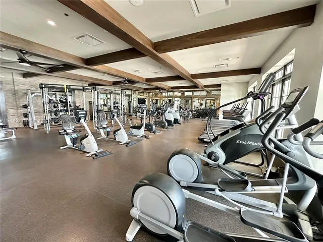 a view of a room with lots of wooden furniture