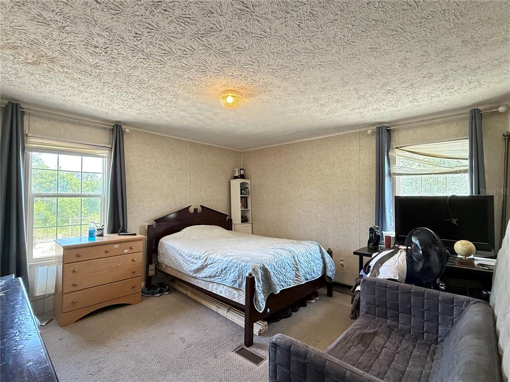 11101 Sumner Road Wimauma, FL 33598 - Photo 18 of 22 a bedroom with a bed and window