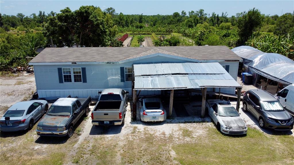 11101 Sumner Road Wimauma, FL 33598 - Photo 8 of 22 a car parked in front of a house