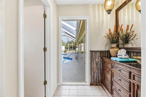 a bathroom with a granite countertop sink a mirror and shower