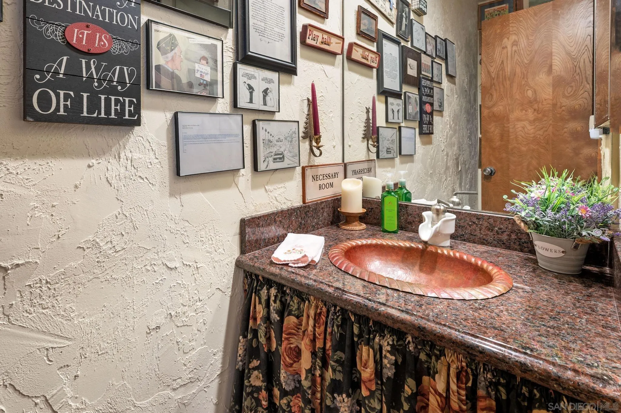 24572 Rutherford Road Ramona, CA 92065 - Photo 21 of 62 a bathroom with a granite countertop sink a mirror and vanity
