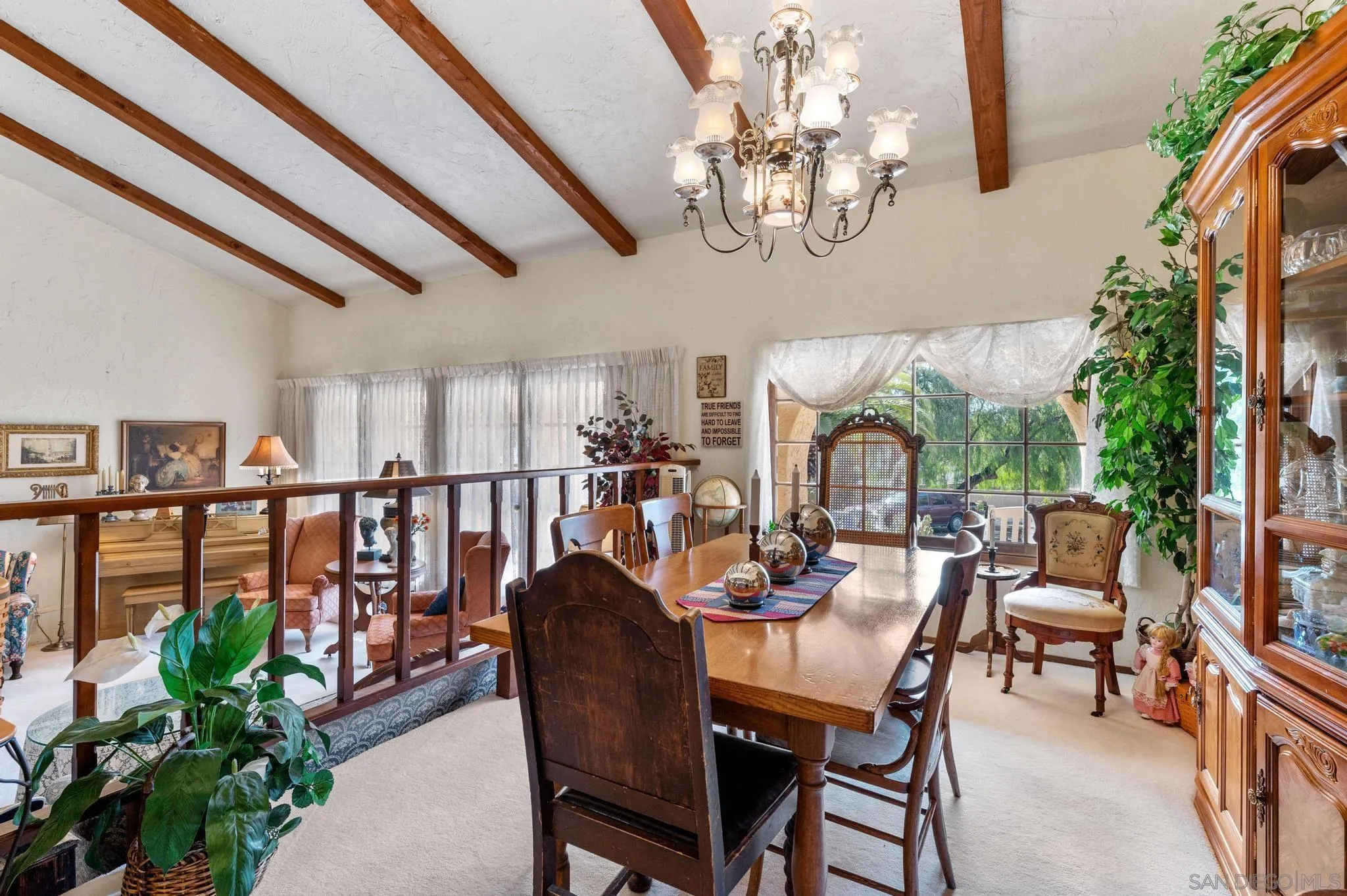 24572 Rutherford Road Ramona, CA 92065 - Photo 22 of 62 a view of a dining room with furniture window and wooden floor