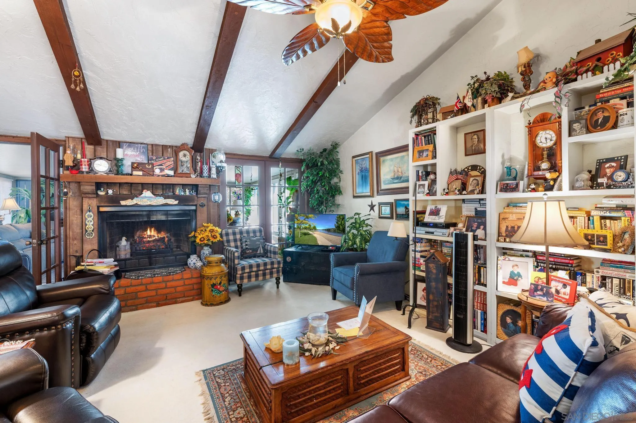 24572 Rutherford Road Ramona, CA 92065 - Photo 26 of 62 a living room with lots of furniture and a fireplace