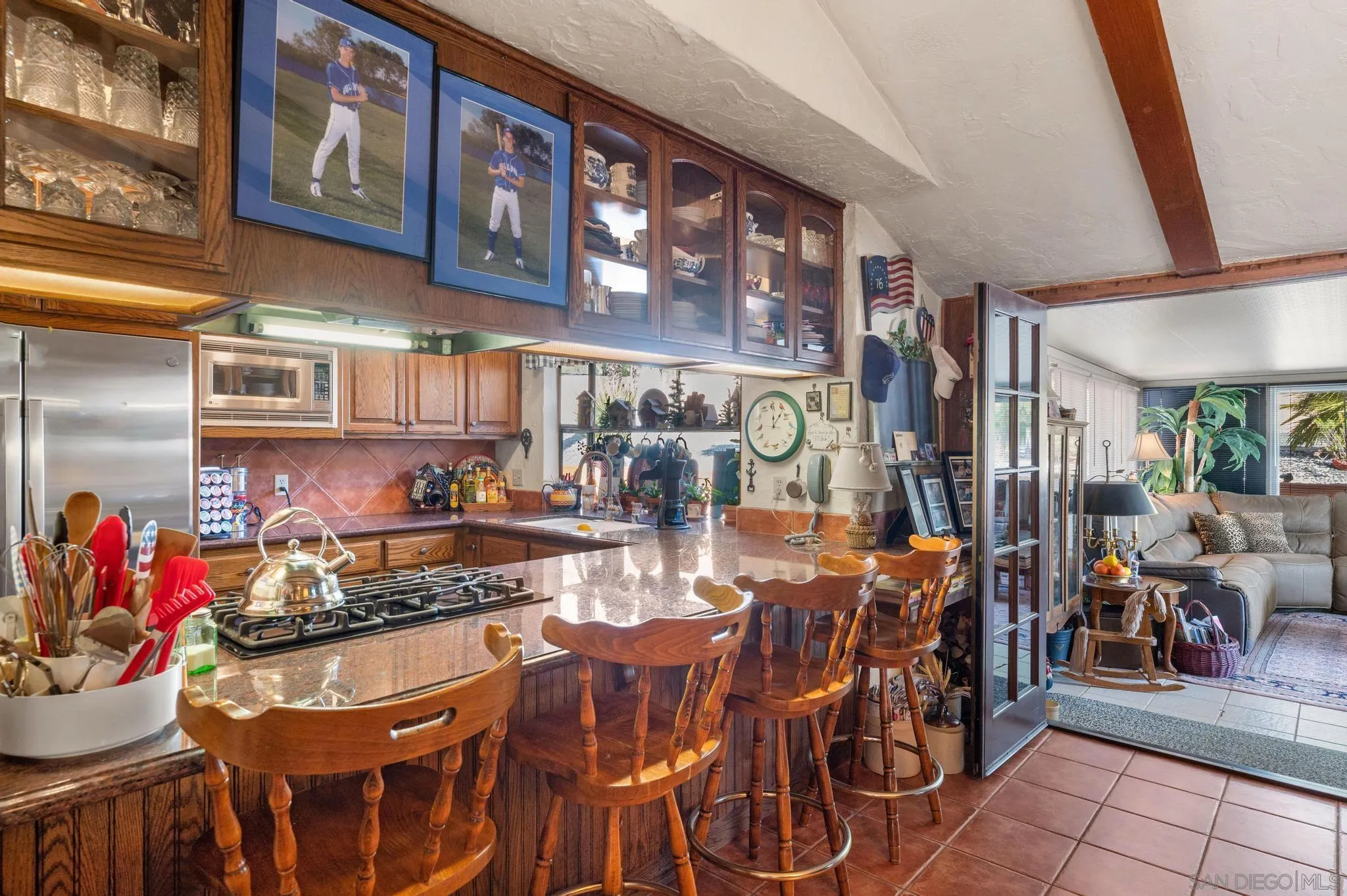 24572 Rutherford Road Ramona, CA 92065 - Photo 29 of 62 a view of a dining room with furniture and chandelier