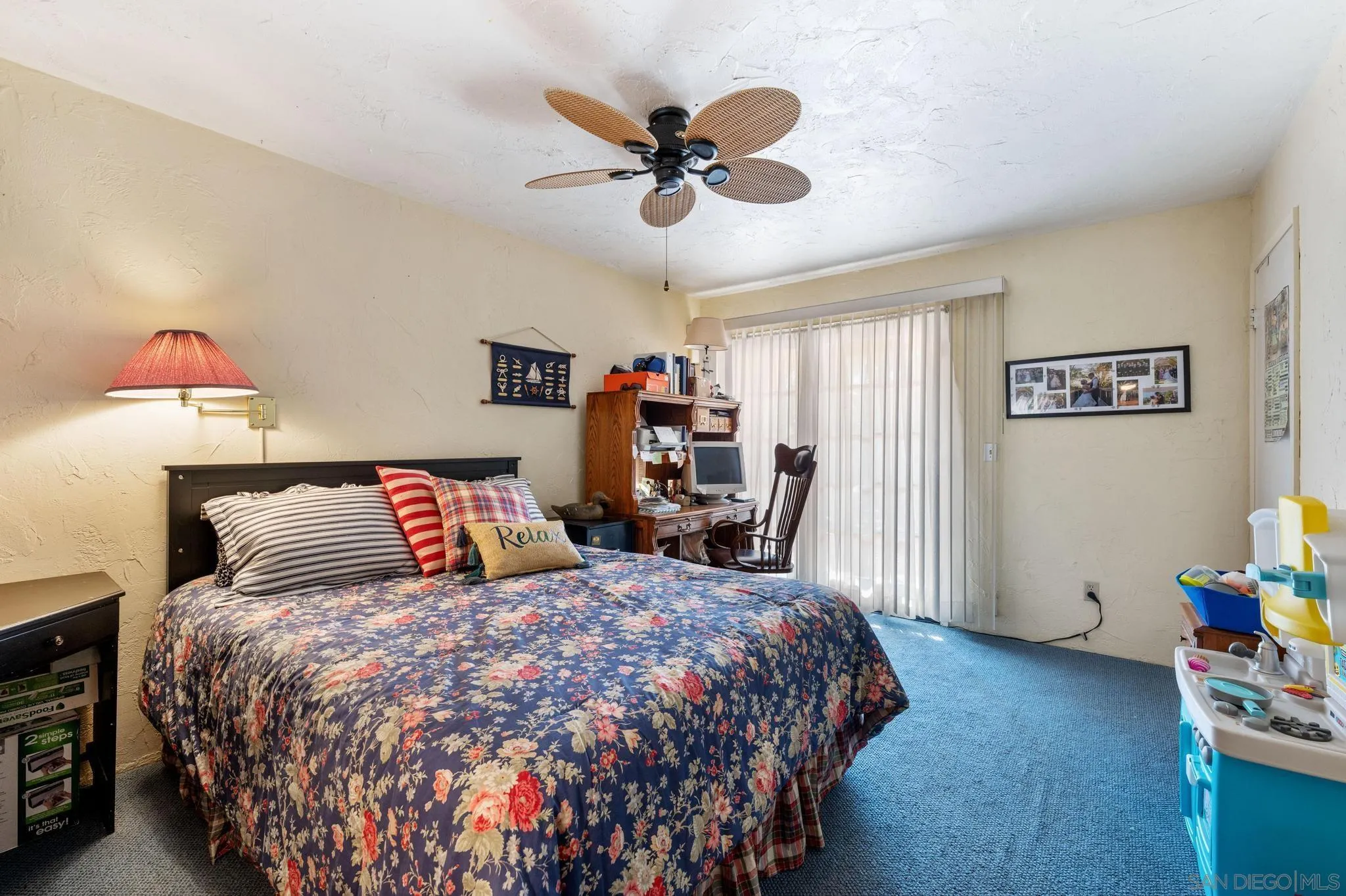 24572 Rutherford Road Ramona, CA 92065 - Photo 36 of 62 a bedroom with a bed and a chandelier