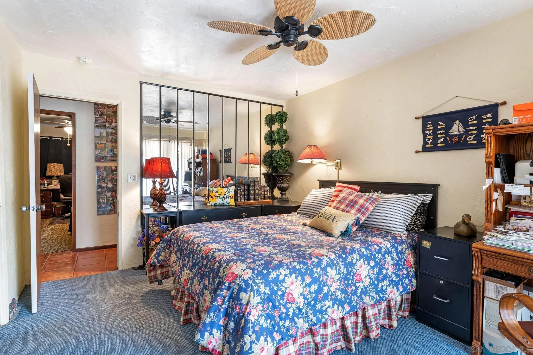 24572 Rutherford Road Ramona, CA 92065 - Photo 37 of 62 a bedroom with a bed and a chandelier