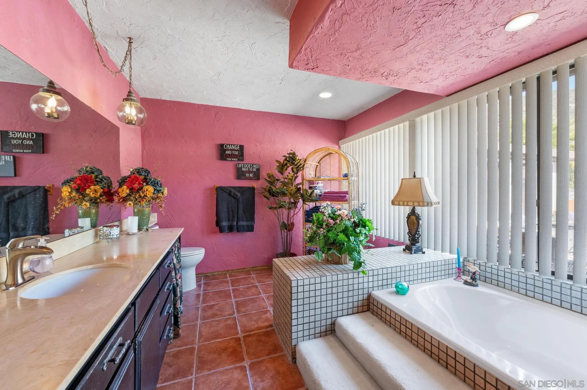 24572 Rutherford Road Ramona, CA 92065 - Photo 45 of 62 a dining hall with furniture and a potted plant