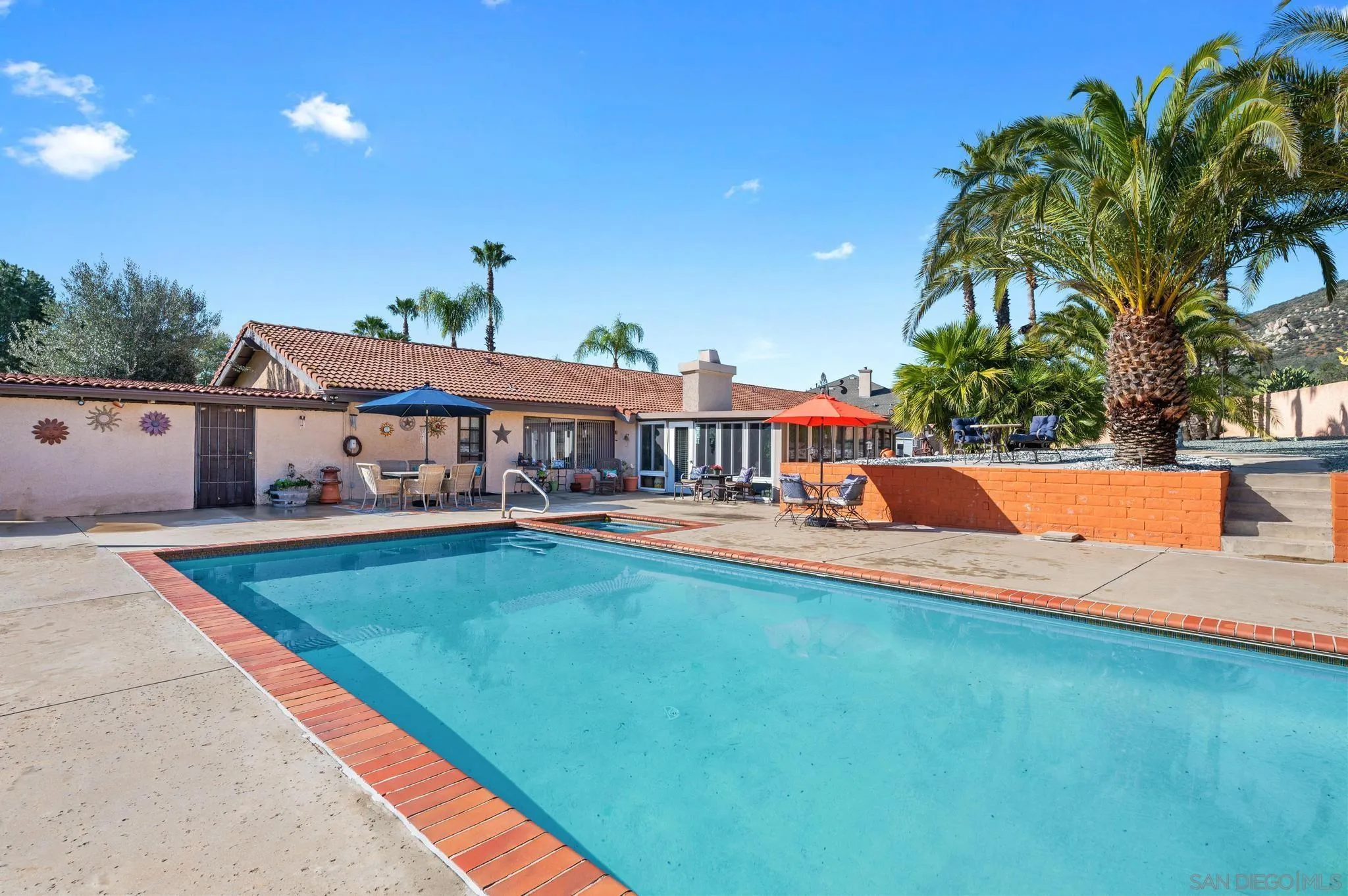 24572 Rutherford Road Ramona, CA 92065 - Photo 49 of 62 a view of a house with pool and sitting area