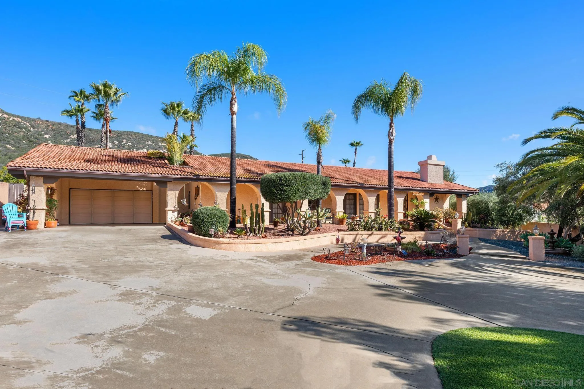 24572 Rutherford Road Ramona, CA 92065 - Photo 6 of 62 a view of a house with a yard and sitting area