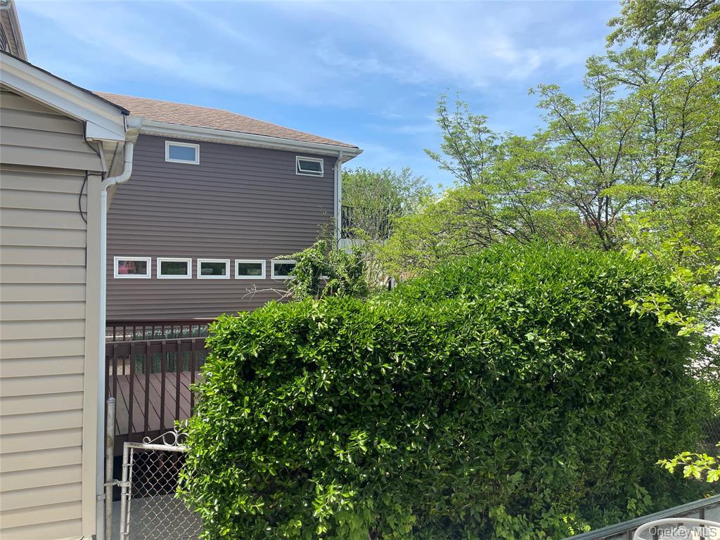 248-29 88th Road Queens, NY 11426 - Photo 19 of 21 a backyard of a house with lots of green space