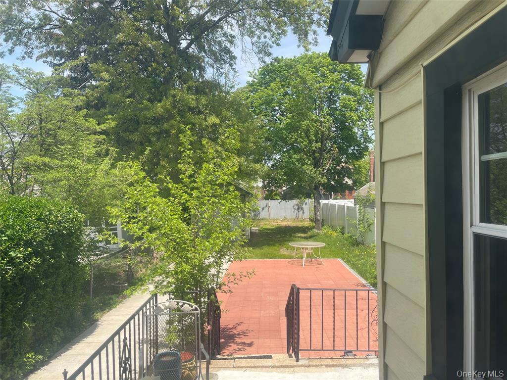 248-29 88th Road Queens, NY 11426 - Photo 20 of 20 a view of a small yard from a balcony