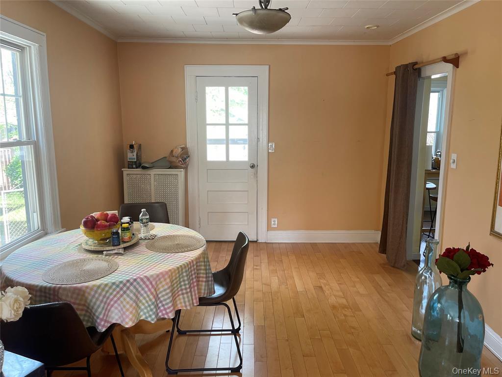 248-29 88th Road Queens, NY 11426 - Photo 6 of 21 a view of a dining room with furniture and window