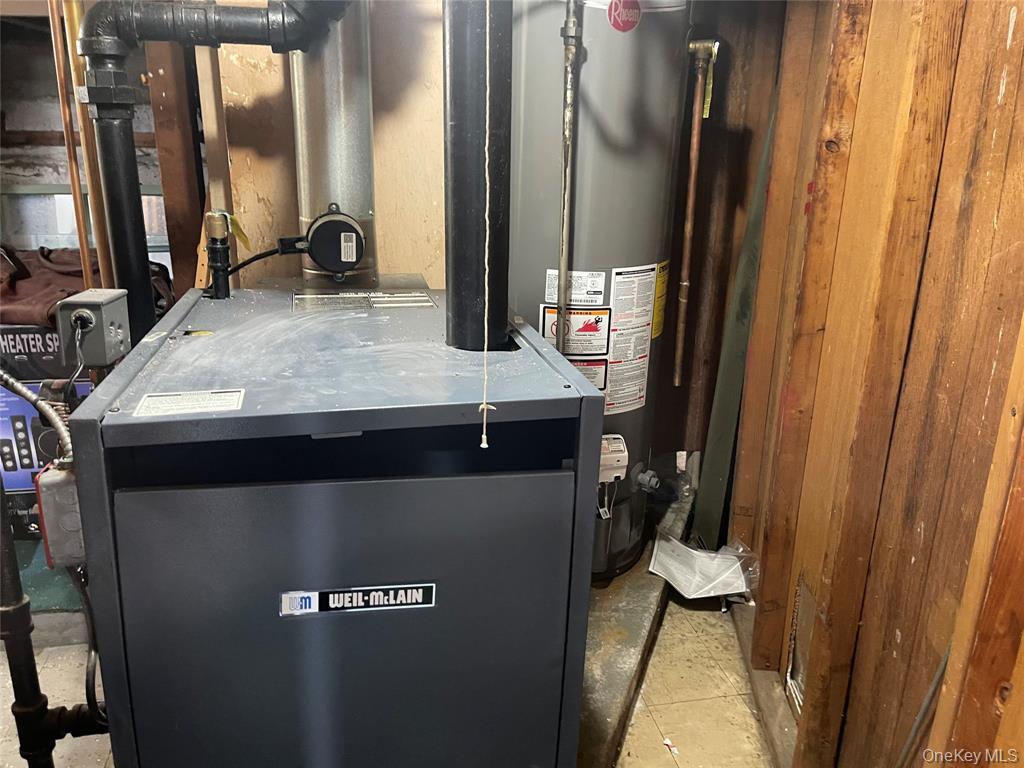 248-29 88th Road Queens, NY 11426 - Photo 8 of 20 a room with stainless steel appliances kitchen island a refrigerator sink and mirror