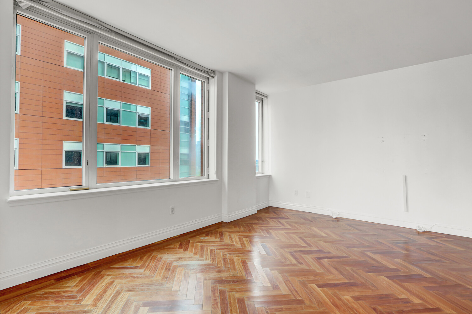 90 East End Avenue, Unit 10B Manhattan, NY 10028 - Photo 10 of 39 a view of empty room with windows