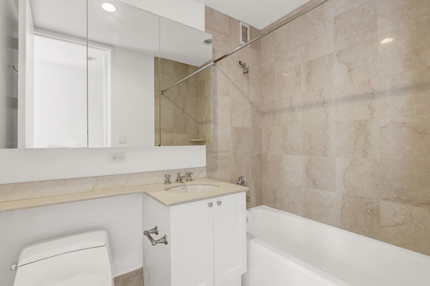 90 East End Avenue, Unit 10B Manhattan, NY 10028 - Photo 22 of 39 a bathroom with a sink a toilet and a bathtub